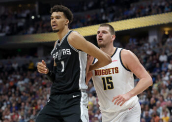 DENVER, COLORADO - JANUARY 03: Victor Wembanyama #1 of the San Antonio Spurs is guarded by Nikola Jokic #15 of the Denver Nuggets in the fourth quarter at Ball Arena on January 03, 2025 in Denver, Colorado. NOTE TO USER: User expressly acknowledges and agrees that, by downloading and or using this photograph, User is consenting to the terms and conditions of the Getty Images License Agreement.  (Photo by Matthew Stockman/Getty Images)