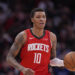 Houston Rockets' Jabari Smith Jr. (10) brings the ball up the court against the Dallas Mavericks during the second half of an NBA basketball game Wednesday, Jan. 1, 2025, in Houston. The Rockets won 110-99. (AP Photo/David J. Phillip)