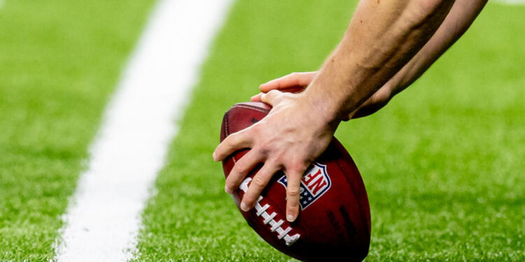 Dec 29, 2024; New Orleans, Louisiana, USA;  Detailed view of the NFL football being hiked during the second half of the game between the New Orleans Saints and the Las Vegas Raiders at Caesars Superdome. Mandatory Credit: Stephen Lew-Imagn Images