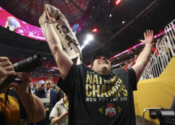 ATLANTA, GEORGIA - JANUARY 20: Will Howard #18 of the Ohio State Buckeyes walks off the field after winning the 2025 College Football Playoff National Championship against the Notre Dame Fighting Irish held at Mercedes-Benz Stadium on January 20, 2025 in Atlanta, Georgia. (Photo by Jamie Schwaberow/Getty Images)