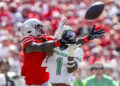 Sep 21, 2024; Columbus, Ohio, USA; Ohio State Buckeyes wide receiver Jeremiah Smith (4) goes for the ball with Marshall Thundering Herd defensive back Josh Moten (1) during the first quarter at Ohio Stadium. Mandatory Credit: Joseph Maiorana-Imagn Images