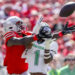 Sep 21, 2024; Columbus, Ohio, USA; Ohio State Buckeyes wide receiver Jeremiah Smith (4) goes for the ball with Marshall Thundering Herd defensive back Josh Moten (1) during the first quarter at Ohio Stadium. Mandatory Credit: Joseph Maiorana-Imagn Images