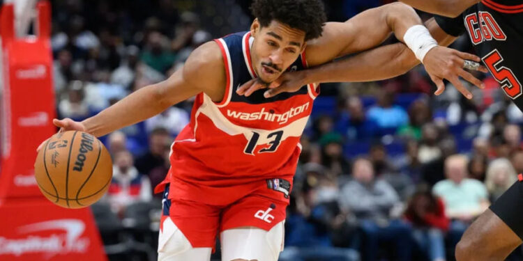 Jan 1, 2025; Washington, District of Columbia, USA; Washington Wizards guard Jordan Poole (13) drives to the basket against Chicago Bulls forward Dalen Terry (25) during the second quarter at Capital One Arena. Mandatory Credit: Reggie Hildred-Imagn Images