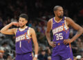 Nov 27, 2024; Phoenix, Arizona, USA; Phoenix Suns guard Devin Booker (1) and Phoenix Suns forward Kevin Durant (35) look on against the Brooklyn Nets during the second half at Footprint Center. Mandatory Credit: Joe Camporeale-Imagn Images