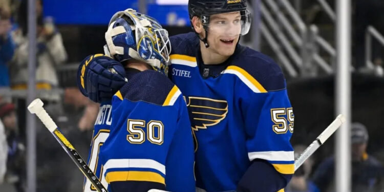 Nov 14, 2023; St. Louis, Missouri, USA; St. Louis Blues goaltender Jordan Binnington (50) and defenseman Colton Parayko (55) celebrate after the Blues defeated the Tampa Bay Lightning at Enterprise Center. credits: Jeff Curry-USA TODAY Sports