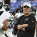 Aug 9, 2024; Baltimore, Maryland, USA; Philadelphia Eagles offensive coordinator Kellen Moore looks on as quarterback Jalen Hurts (1) throws before a preseason game against the Baltimore Ravens at M&amp;T Bank Stadium. Mandatory Credit: Tommy Gilligan-Imagn Images