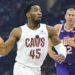 Jan 20, 2025; Cleveland, Ohio, USA; Cleveland Cavaliers guard Donovan Mitchell (45) drives to the basket beside Phoenix Suns center Mason Plumlee (22) in the first quarter at Rocket Mortgage FieldHouse. Mandatory Credit: David Richard-Imagn Images