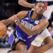 Jan 19, 2025; Sacramento, California, USA; Sacramento Kings guard De'Aaron Fox (5) drives to the basket against the Washington Wizards during the fourth quarter at Golden 1 Center. Mandatory Credit: Ed Szczepanski-Imagn Images