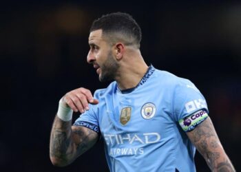 Kyle Walker plays as captain for Manchester City during the Premier League match against Manchester United.