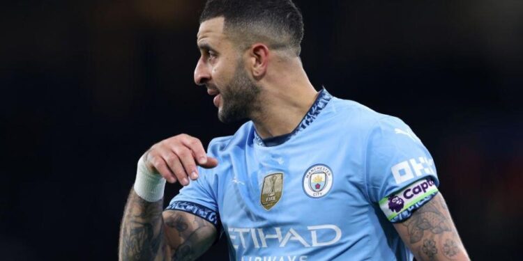 Kyle Walker plays as captain for Manchester City during the Premier League match against Manchester United.