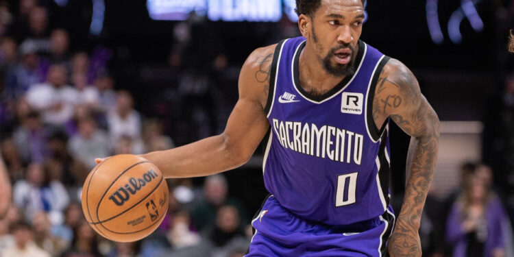 Jan 19, 2025; Sacramento, California, USA; Sacramento Kings guard Malik Monk (0) controls the ball against the Washington Wizards during the third quarter at Golden 1 Center. Mandatory Credit: Ed Szczepanski-Imagn Images