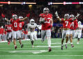 ARLINGTON, TEXAS - JANUARY 10: Jack Sawyer #33 of the Ohio State Buckeyes runs with the ball after recovering a fumble in the fourth quarter against the Texas Longhorns during the Goodyear Cotton Bowl at AT&T Stadium on January 10, 2025 in Arlington, Texas. (Photo by Alex Slitz/Getty Images)