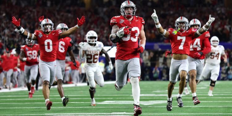 ARLINGTON, TEXAS - JANUARY 10: Jack Sawyer #33 of the Ohio State Buckeyes runs with the ball after recovering a fumble in the fourth quarter against the Texas Longhorns during the Goodyear Cotton Bowl at AT&T Stadium on January 10, 2025 in Arlington, Texas. (Photo by Alex Slitz/Getty Images)