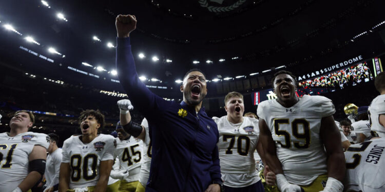 NEW ORLEANS, LOUISIANA - JANUARY 02: Head coach Marcus Freeman of the Notre Dame Fighting Irish celebrates with his team after a 23-10 victory against the Georgia Bulldogs in the 91st Allstate Sugar Bowl at Caesars Superdome on January 02, 2025 in New Orleans, Louisiana. (Photo by Sean Gardner/Getty Images)