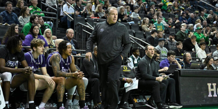 Dec 15, 2024; Eugene, Oregon, USA; Stephen F. Austin Lumberjacks head coach Kyle Keller watches his team during the first half against the Oregon Ducks at Matthew Knight Arena. Mandatory Credit: Craig Strobeck-Imagn Images