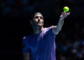 Jan 14, 2025; Melbourne, Victoria, Australia; Taylor Fritz of United States of America serves during his match against Jenson Brooksby of United States of America in the first round of the men's singles at the 2025 Australian Open at Melbourne Park. Mandatory Credit: Mike Frey-Imagn Images