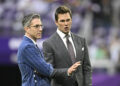 MINNEAPOLIS, MINNESOTA - DECEMBER 29: Broadcasters Tom Brady (R) and Kevin Burkhardt (L) speak on the field as players warm up before the game between the Green Bay Packers and Minnesota Vikings at U.S. Bank Stadium on December 29, 2024 in Minneapolis, Minnesota. (Photo by Stephen Maturen/Getty Images)