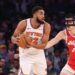 Jan 27, 2025; New York, New York, USA; New York Knicks center Karl-Anthony Towns (32) is guarded by Memphis Grizzlies center Zach Edey (14) during the first half at Madison Square Garden. Mandatory Credit: Vincent Carchietta-Imagn Images