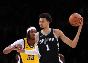 San Antonio Spurs' French forward-center #01 Victor Wembanyama (R) holds the ball as Indiana Pacers' US center #33 Myles Turner (L) defends during the NBA basketball game between the San Antonio Spurs and the Indiana Pacers at the Accor Arena - Palais Omnisports de Paris-Bercy - in Paris on January 25, 2025. (Photo by FRANCK FIFE / AFP) (Photo by FRANCK FIFE/AFP via Getty Images)