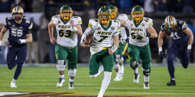 FRISCO, TX - JANUARY 06: North Dakota State Bison quarterback Cam Miller (7) breaks through the line during the FCS Championship game between North Dakota State and Montana State on January 6, 2025 at Toyota Stadium in Frisco, TX. (Photo by George Walker/Icon Sportswire via Getty Images)