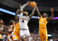 Jan 25, 2025; Auburn, Alabama, USA;  Auburn Tigers forward Johni Broome (4) shoots the ball against Tennessee Volunteers guard Jahmai Mashack (15) during the second half at Neville Arena. Mandatory Credit: John Reed-Imagn Images