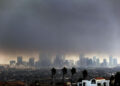 Thick heavy smoke from wildfires shrouds downtown Los Angeles on Wednesday, Jan. 8, 2025. (AP Photo/Richard Vogel)