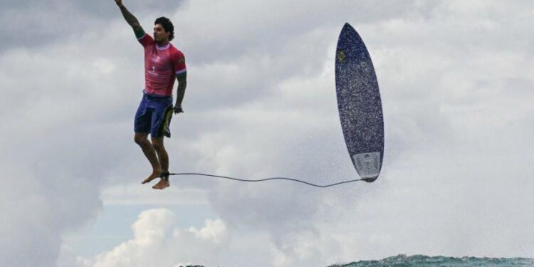 The third day of the surfing Olympic event in French Polynesia at Teahupo’o, Brazilian surfer Gabriel Medina gets the biggest wave of the competition and celebrates in a unique position by thanking God. July 29, 2024