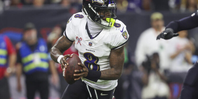 Dec 25, 2024; Houston, Texas, USA;  Baltimore Ravens quarterback Lamar Jackson (8) rolls out of the pocket with the ball during the game against the Houston Texans at NRG Stadium. Mandatory Credit: Troy Taormina-Imagn Images