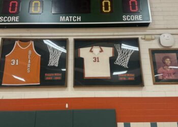 The jersey display at Riverside Poly High School honoring Reggie Miller and sister Cheryl Miller.