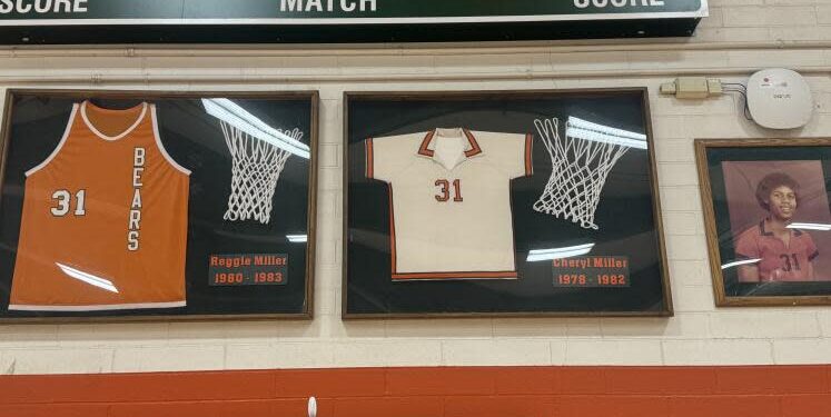 The jersey display at Riverside Poly High School honoring Reggie Miller and sister Cheryl Miller.