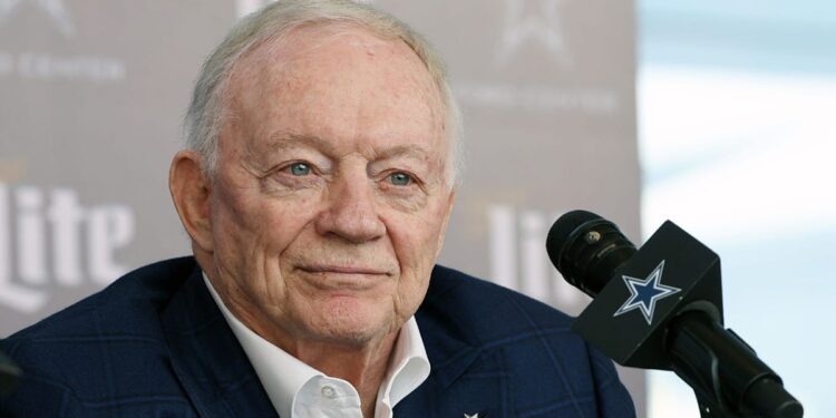 Jerry Jones talks to reporters