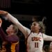 Southern California guard Kennedy Smith (11) defends against Minnesota guard Grace Grocholski.