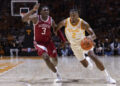 Tennessee guard Chaz Lanier (2) drives against Arkansas forward Adou Thiero (3) during the first half of an NCAA college basketball game Saturday, Jan. 4, 2025, in Knoxville, Tenn. (AP Photo/Wade Payne)