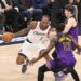 Clippers forward Kawhi Leonard, center, tries to drive past Lakers forwards Austin Reaves, top, and Dorian Finney-Smith