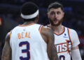 LOS ANGELES, CALIFORNIA - APRIL 10: Jusuf Nurkic #20 of the Phoenix Suns talks with Bradley Beal #3 during a 124-108 win over the LA Clippers at Crypto.com Arena on April 10, 2024 in Los Angeles, California. User is consenting to the terms and conditions of the Getty Images License Agreement.  (Photo by Harry How/Getty Images)