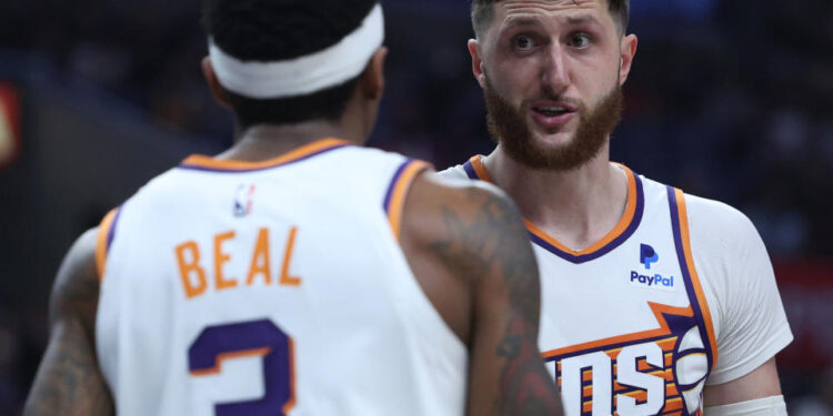 LOS ANGELES, CALIFORNIA - APRIL 10: Jusuf Nurkic #20 of the Phoenix Suns talks with Bradley Beal #3 during a 124-108 win over the LA Clippers at Crypto.com Arena on April 10, 2024 in Los Angeles, California. User is consenting to the terms and conditions of the Getty Images License Agreement.  (Photo by Harry How/Getty Images)