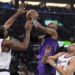 Los Angeles Lakers forward LeBron James, center, shoots as Los Angeles Clippers forward Kawhi Leonard.