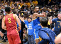 MORGANTOWN, WEST VIRGINIA - JANUARY 18: Javon Small #7 of the West Virginia Mountaineers celebrates as fans storm the court after a 64-57 victory against the Iowa State Cyclones at WVU Coliseum on January 18, 2025 in Morgantown, West Virginia. (Photo by Greg Fiume/Getty Images)