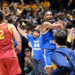 MORGANTOWN, WEST VIRGINIA - JANUARY 18: Javon Small #7 of the West Virginia Mountaineers celebrates as fans storm the court after a 64-57 victory against the Iowa State Cyclones at WVU Coliseum on January 18, 2025 in Morgantown, West Virginia. (Photo by Greg Fiume/Getty Images)