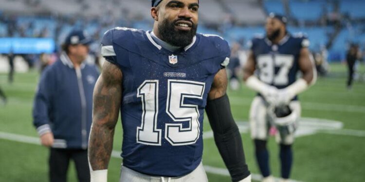 Dallas Cowboys running back Ezekiel Elliott (15) walks off the field after an NFL football game.