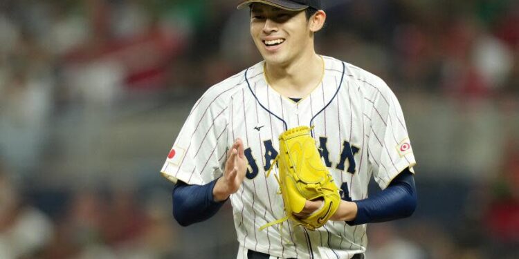 Roki Sasaki smiles while pitching for Japan in the World Baseball Classic in March 2023.