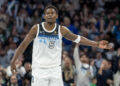 Jan 2, 2025; Minneapolis, Minnesota, USA; Minnesota Timberwolves guard Anthony Edwards (5) celebrates after making a three point shot against the Boston Celtics in the second half at Target Center. Mandatory Credit: Jesse Johnson-Imagn Images