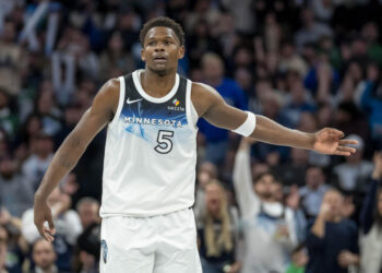 Jan 2, 2025; Minneapolis, Minnesota, USA; Minnesota Timberwolves guard Anthony Edwards (5) celebrates after making a three point shot against the Boston Celtics in the second half at Target Center. Mandatory Credit: Jesse Johnson-Imagn Images