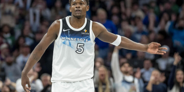 Jan 2, 2025; Minneapolis, Minnesota, USA; Minnesota Timberwolves guard Anthony Edwards (5) celebrates after making a three point shot against the Boston Celtics in the second half at Target Center. Mandatory Credit: Jesse Johnson-Imagn Images