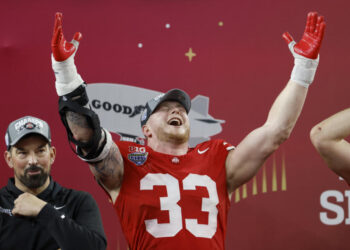 ARLINGTON, TEXAS - JANUARY 10: Jack Sawyer #33 of the Ohio State Buckeyes celebrates during the trophy ceremony after beating the Texas Longhorns 28-14 to win the Goodyear Cotton Bowl at AT&T Stadium on January 10, 2025 in Arlington, Texas. (Photo by Ron Jenkins/Getty Images)