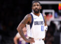 Kyrie Irving will reportedly join his injured backcourt mate Luka Dončić on the sideline. (Chris Coduto/Getty Images)