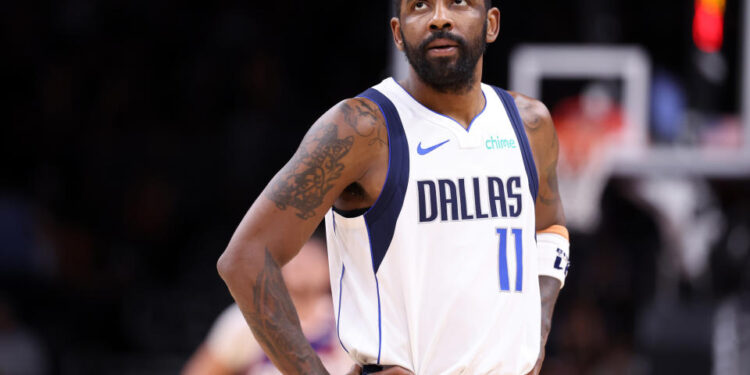 Kyrie Irving will reportedly join his injured backcourt mate Luka Dončić on the sideline. (Chris Coduto/Getty Images)