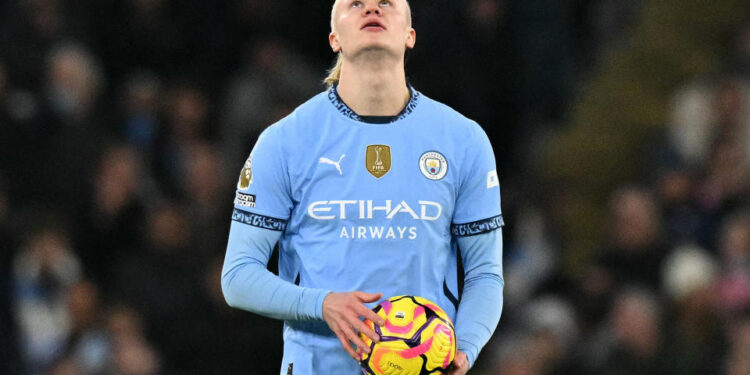 Manchester City's Norwegian striker #09 Erling Haaland reacts after the team conceded the opening goal during the English Premier League football match between Manchester City and Chelsea at the Etihad Stadium in Manchester, north west England, on January 25, 2025. (Photo by Oli SCARFF / AFP) / RESTRICTED TO EDITORIAL USE. No use with unauthorized audio, video, data, fixture lists, club/league logos or 'live' services. Online in-match use limited to 120 images. An additional 40 images may be used in extra time. No video emulation. Social media in-match use limited to 120 images. An additional 40 images may be used in extra time. No use in betting publications, games or single club/league/player publications. /  (Photo by OLI SCARFF/AFP via Getty Images)