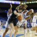 UCLA forward Janiah Barker battles Cal Poly forward Nora Perez to force a jump ball at Pauley Pavilion.