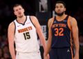 Jan 29, 2025; New York, New York, USA; Denver Nuggets center Nikola Jokic (15) and New York Knicks center Karl-Anthony Towns (32) react during the fourth quarter at Madison Square Garden.